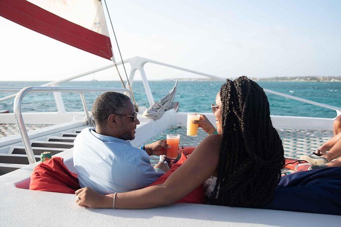 Aruba Sunset Sail Dinner Cruise with Open Bar by Catamaran - Deck time and the onboard vibe: music, dancing, and why the crew matters