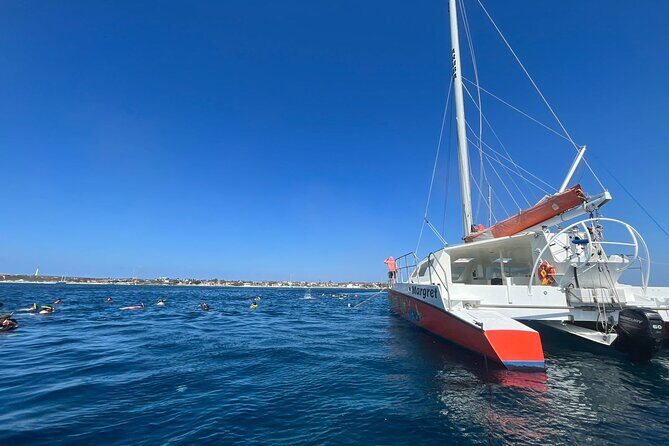 Banana Adventure Catamaran Tropical Sunset Sail - Cruising Past Hotels Toward Oranjestad Harbor