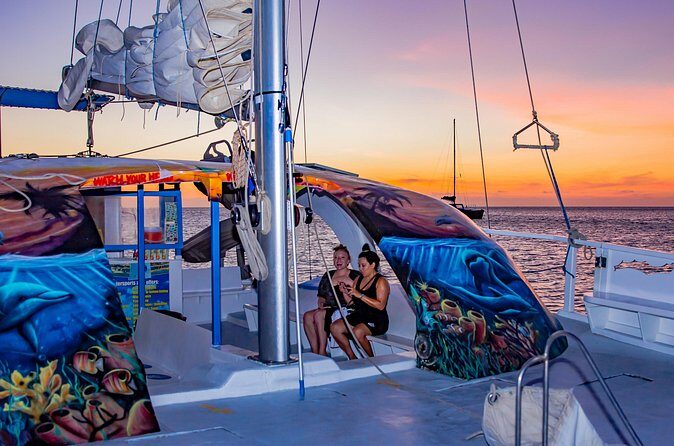 Private Sunset Catamaran Adventure Cruise with Open Bar - Passing Arashi Beach: the scenery keeps coming